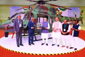 Indian Prime Minister unveils a Light Utility Helicopter (LUH) produced by HAL at the comapny's new Tumakuru factory. HAL Photo