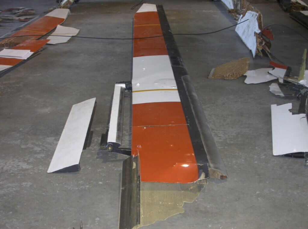 In a 2010 crash, a servo flap afterbody also separated along a straight spanwise line just aft of its pivot point. NTSB Photo