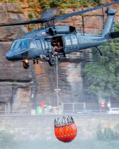 A Polish police Sikorsky S-70i Black Hawk carries a water bucket to tackle a fire. Tagged on Instagram by y.ahlers