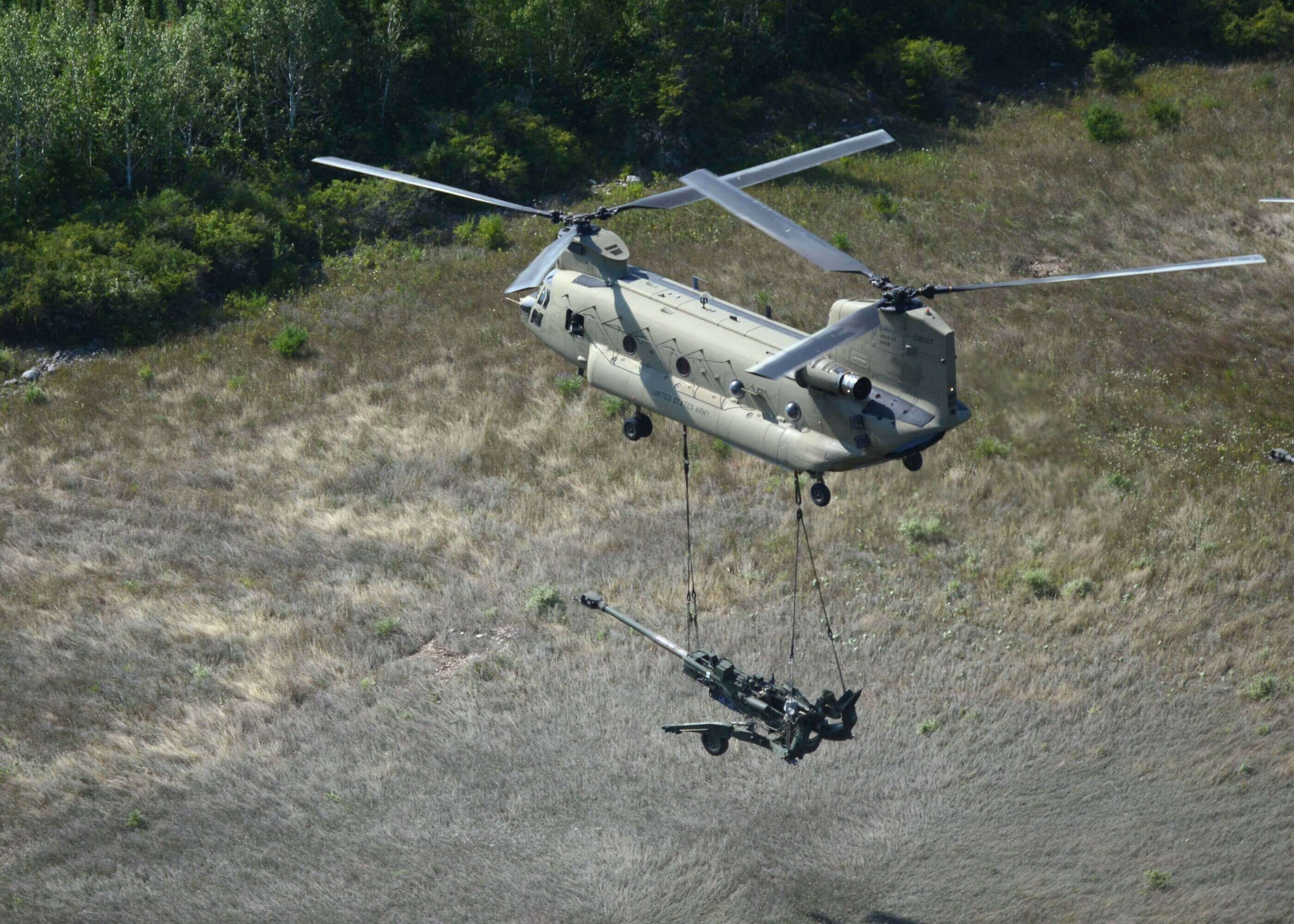 A U.S. Army CH-47F performs a sling load during a training exercise