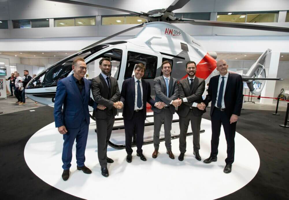 Executives from Leonardo and Léman Aviation shake hands following the announcement of preliminary sales contracts for 10 AW09s. Leonardo Photo