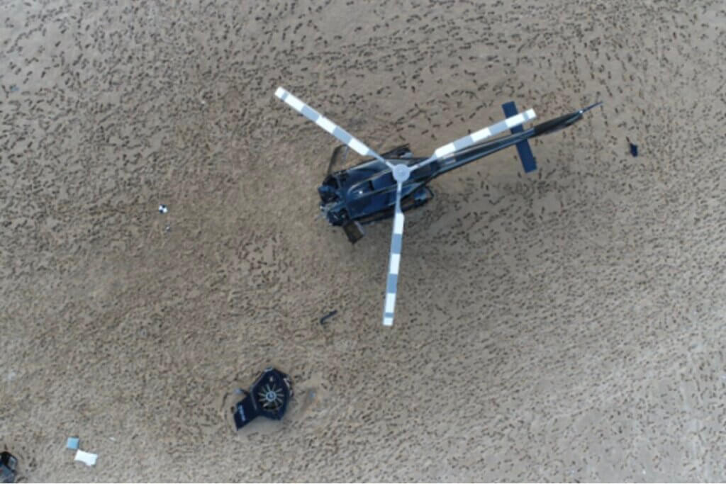 This view from above shows the scale of the damage to the front of XH9, shown on the sandbar alongside XKQ's severed Fenestron. Queensland Police Service Photo