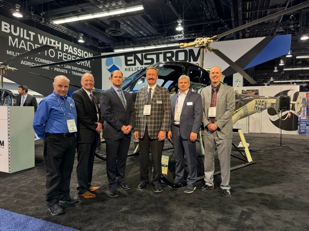 Enstrom leadership at the manufacturer's booth at HAI Heli-Expo 2024. Brent Bundy Photo