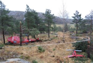 The helicopter’s final position was about 160 feet (50 meters) east of a pylon foundation. The tail rotor with the vertical stabiliser on the right. NSIA Photo