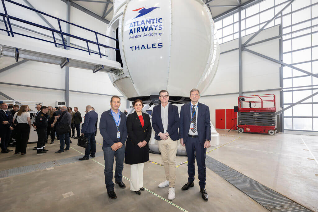 Executives from Thales, Atlantic Airways and SIM International stand in front of the AW139 FFS. Ólavur Frederiksen Photo