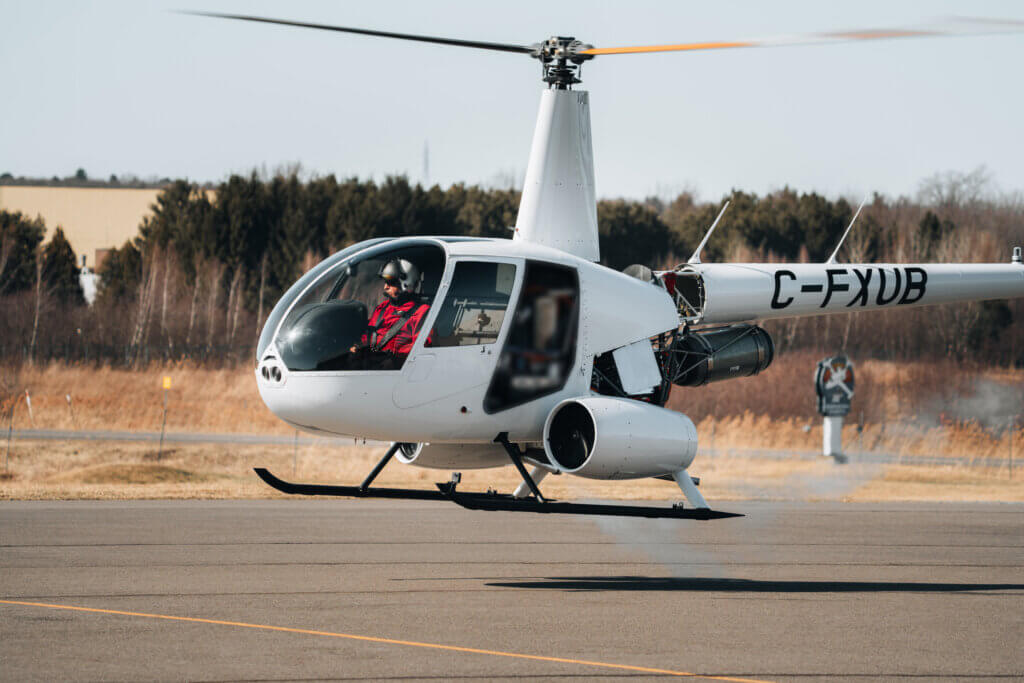Unither Bioélectronique test pilot Ric Webb performs a hover flight in the company’s experimental hydrogen-powered R44 helicopter on March 27 at Roland-Désourdy Airport in Bromont, Québec. Peter Krieger via Press Record Media Photo