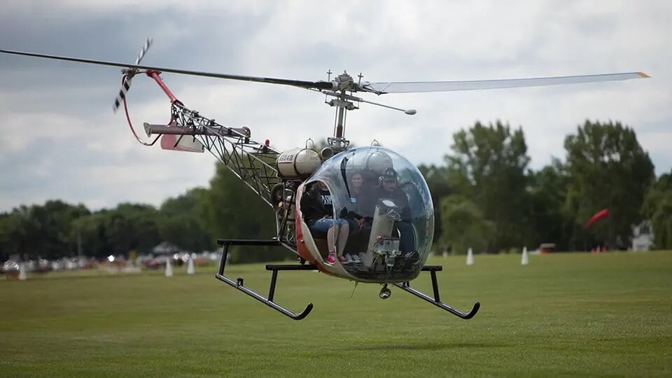 A Bell-47 helicopter lifts off for a flight. Craig Kolk/EAA Photo