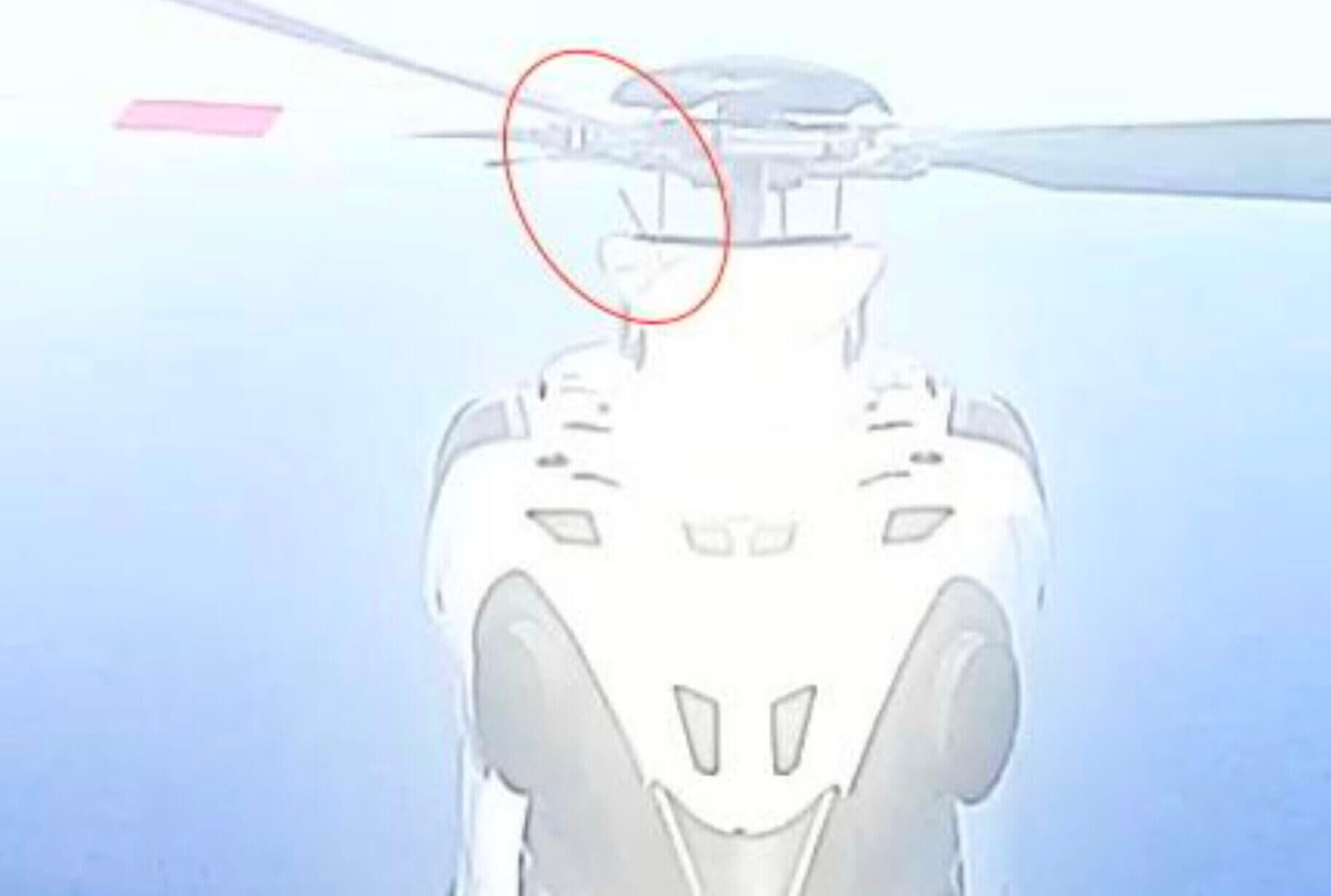 The moment the white blade's upper rod end bearing ruptured during the flight, captured by the aircraft's tail boom camera.